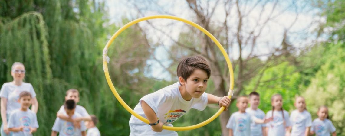 Kids enjoying a summer day playing with hula hoops in a park, showcasing friendship and fun.
